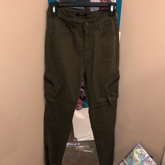 Olive green pants with zippers on the side. - Picture 1 of 2